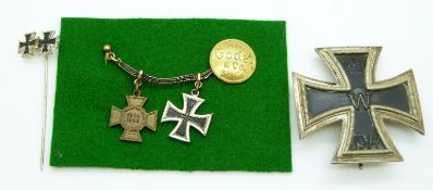German WWI Iron Cross First Class 1914 medal, BH Mayer maker, together with miniatures and stick