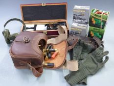 Approximately 150 12 bore and .410 shotgun cartridges together with a gun cleaning kit in wooden