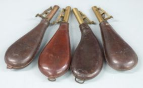 Four leather and brass shot flasks, one kidney shaped and two with belt loops, largest 22.5cm long.