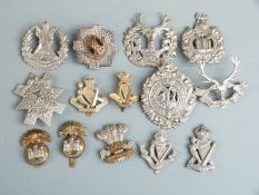 A small collection of regimental cap badges for Scottish and Irish regiments including Black
