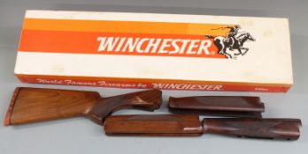 Winchester 55/6500 walnut shotgun stock, 42cm long, and three forends, in Winchester box.