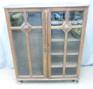 Art Nouveau glazed oak bookcase with adjustable shelves, W106 D30 H129cm