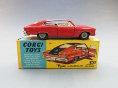 Corgi Toys diecast model Marlin Rambler Sports Fastback with red body, black roof and cream interior