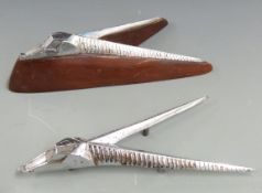 Two Singer Gazelle car mascots, one on wooden display base, length 20cm