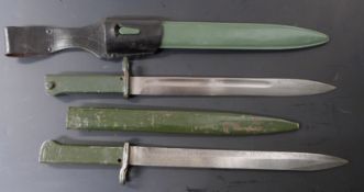 Two German Ersatz all steel bayonets, both with 30.5cm blades, one fullered, both with scabbards and