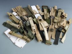 A collection of bayonet frogs, mainly canvas various sizes