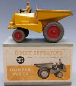 Dinky Supertoys diecast model Dumper Truck with yellow body and red hubs, 562, in original box.