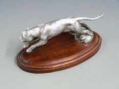 Leaping jaguar or similar big cat vintage car mascot with fur detail, on oval wooden display base,