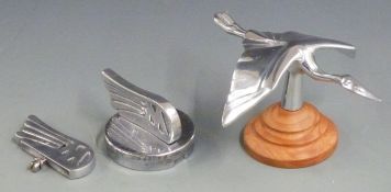 Morgan stork aluminium car mascot on turned wooden base, length 16cm together with a winged M
