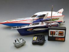 Two remote controlled model boats, one Nikko Caribbean Raider in original box the other Banox Dash