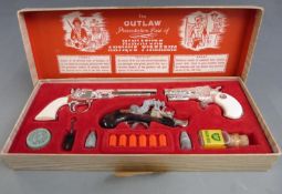 BCM The Outlaw Presentation Case of Miniature Antique Firearms, in original box.