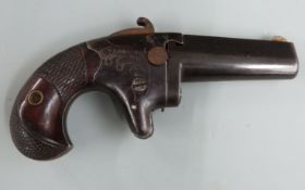 Colt No. 2 .41 rimfire derringer pistol with shaped and chequered grip, engraved decoration,