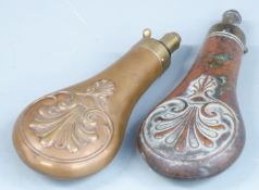 Two copper and brass powder flasks both with embossed decoration to both sides, largest 20.5cm long.