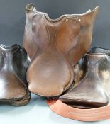 Three leather saddles, stand, warmapet blanket, horse brasses etc