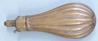 Dixon & Sons copper and brass powder flask with reeded body and acanthus leaf decoration, 21cm long.