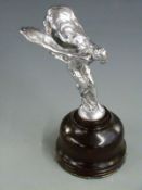 Rolls Royce Spirit of Ecstasy car mascot, on turned wooden base, overall height 18.5cm