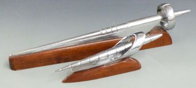 Buick car mascot circa early 1950's, on wooden display base, length 53cm, together with a similar