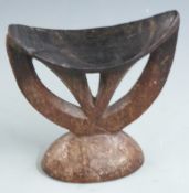 Two 19thC African tribal carved wooden head rests or pillows, H15cm