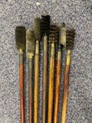 Seven wooden and brass gun cleaning rods.