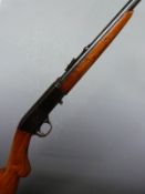 Browning .22 short semi-automatic rifle with semi-pistol grip, adjustable sights and 19 inch barrel,