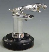 Jaguar car mascot mounted on chrome and ebonised base, overall height 14cm