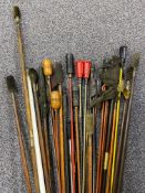 Thirty various wooden and metal gun cleaning rods.