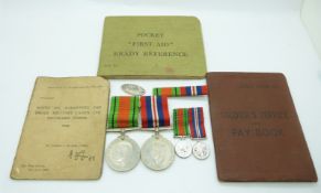 British Army WWII medals comprising War Medal and Defence Medal with miniatures and silver