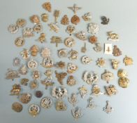 A collection of cap badges, mainly British Infantry regiments including Light Infantry,