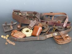 A small collection of military belt pouches and straps etc