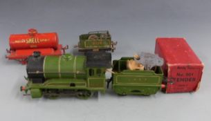 Hornby 0 gauge clockwork locomotive and tender in box and tanker.