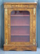 A 19thC inlaid walnut glazed pier cabinet with ormolu mounts, three shelves and velvet lined