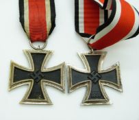 Two German Third Reich Nazi Iron Cross medals with ribbons