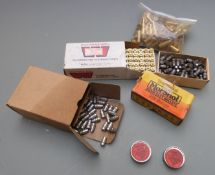 A collection of .38SPL bullets and brass cases, some primed.