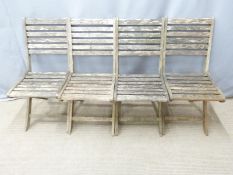 Set of four teak folding garden chairs