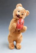 Russian clockwork plush covered bear drinking mead, 23.5cm tall.