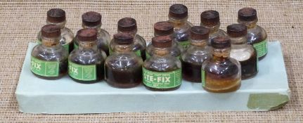 Stephens STE-Fix glue in fourteen bottles with bakelite tops