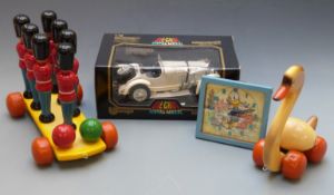 A collection of children's toys comprising Donald Duck Glen Clock animated clock with nodding