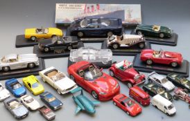Twenty-one Corgi, Dinky, Burago, Maisto and similar diecast model vehicles including Whizzwheels,