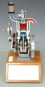 Demonstration educational model 4 stroke diesel engine on base with annotated diagram of engine to
