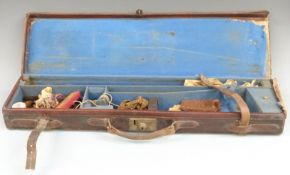 Brown leather bound shotgun case with fitted interior and cleaning kit, 85x23x9cm.