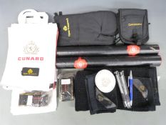 A quantity of Cunard memorabilia from the last voyage of the Queen Elizabeth II July 2008.