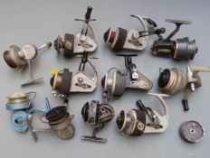 Eleven vintage fixed spool fishing reels including five Allcock and Son Delmatic Mk2 reels, two