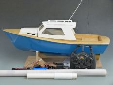 Scratch built wooden remote controlled boat with planked deck, blue painted hull and HiTec Ranger II
