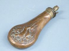 T Collins copper and brass powder flask with embossed decoration of game to both sides, 20.5cm long.