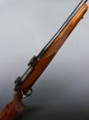 Ruger M77 7x57 bolt-action rifle with chequered semi-pistol grip, sling suspension and scope