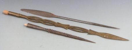 Three African tribal spears including a barbed fish spear, one possibly made from a stair rod etc