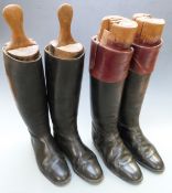 Two pairs of vintage leather riding boots with trees, one set named Rowell and Sons, Melton Mowbray