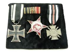 German WWI medal trio comprising Iron Cross, Cross of Honour with Swords and Gallipoli Star with