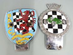 Gaunt car badge with green racing car against a chequered background together with a BARC badge
