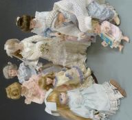 Eight various bisque headed and similar dolls, all in period clothing.
